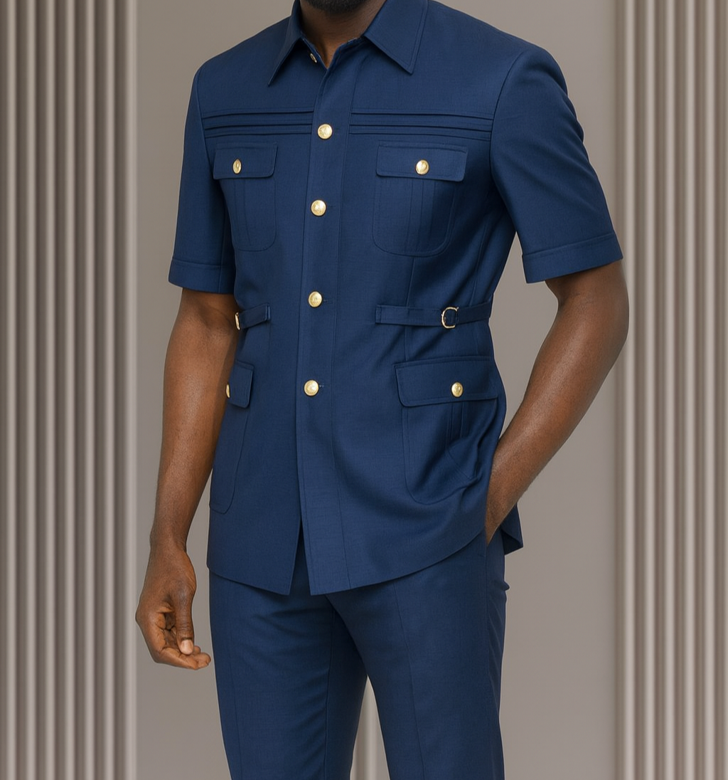 Man wearing a blue outfit with gold buttons against a neutral background