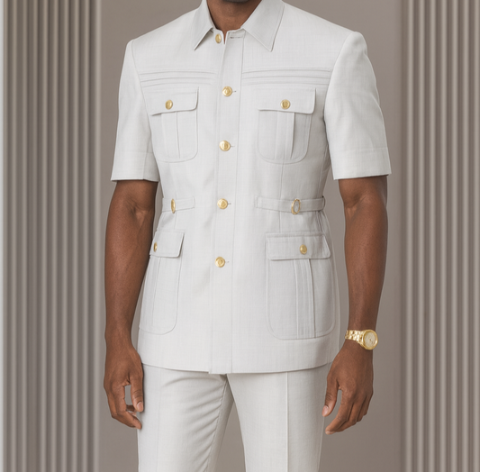 Man wearing a white outfit with gold buttons against a gray background, featuring the brand 'Serena Rivella'.