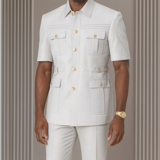 Man wearing a white outfit with gold buttons against a gray background, featuring the brand 'Serena Rivella'.
