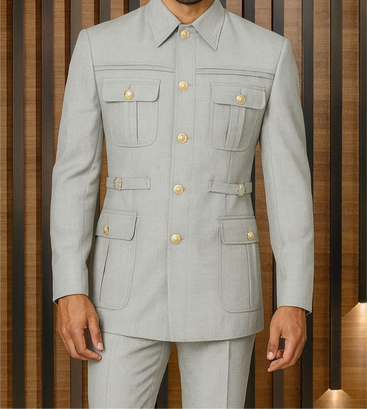 Man wearing a gray suit with gold buttons against a striped brown background
