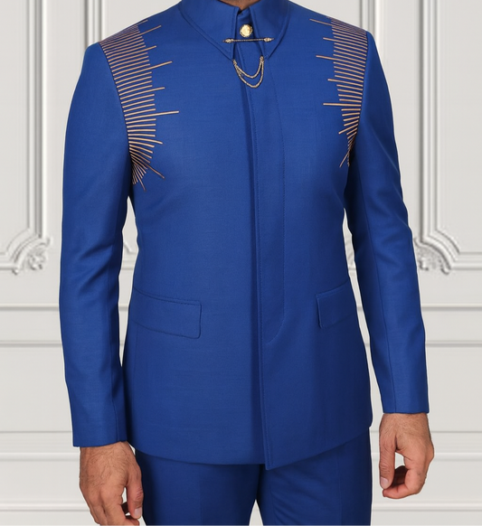 Man wearing a blue suit with intricate designs on a white background